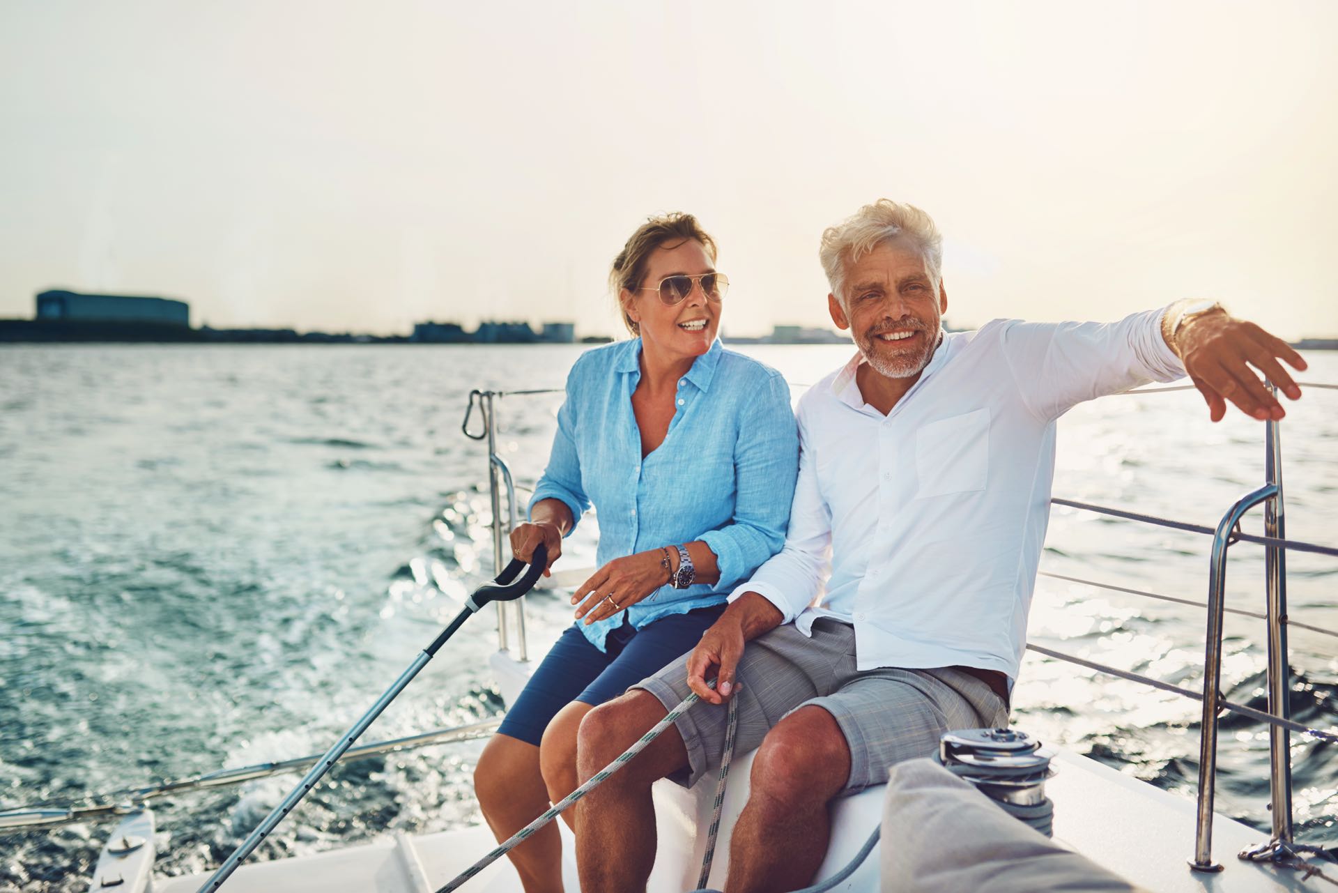 Older couple sitting on a yacht and sailing
